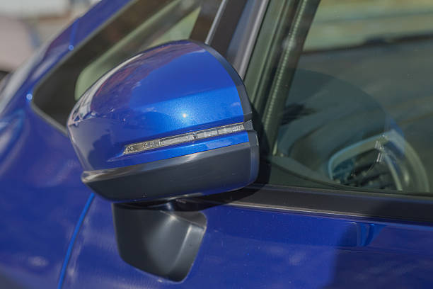istock Side rear-view mirror closed for safety at car park 502580260