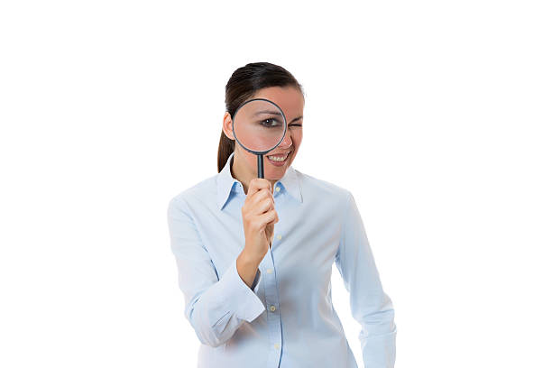 istock young woman with magnifying glass 502580737