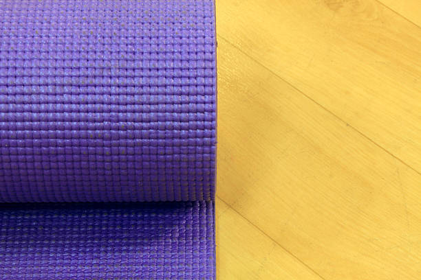 istock Yoga mat on wood background. 502581532