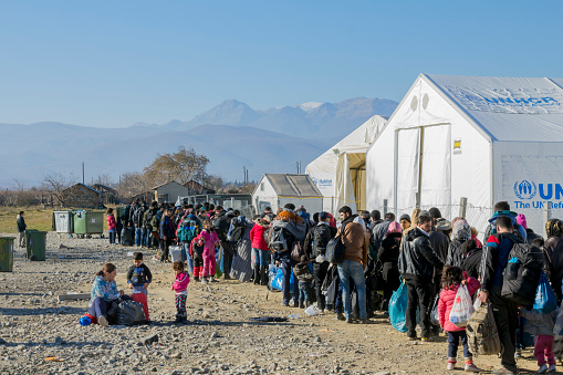 Gevgelija, Republic of Macedonia - December 23, 2015: Refugees waiting to register in the refugee camp of Vinojug in Gevgelija (Macedonia) after having crossed the border with Greece at Eidomeni.
