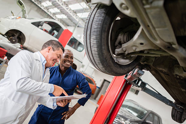 istock Mechanics at a car garage 502583769
