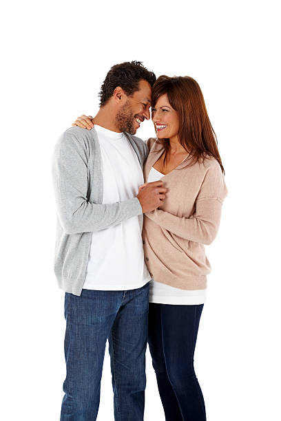 istock Cheerful mature couple standing together against white 502583887