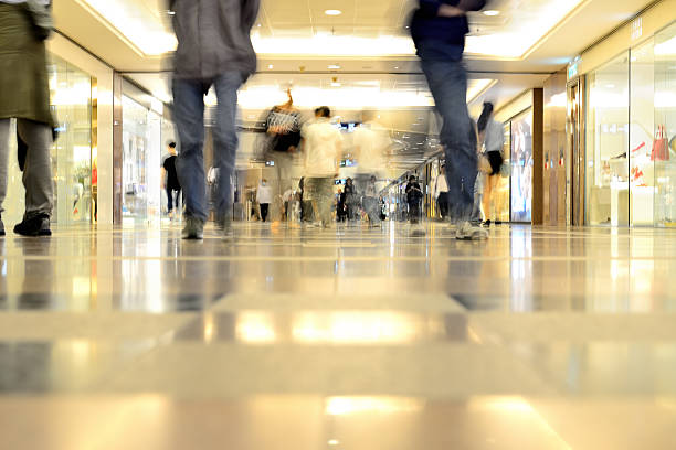 istock Motion blurred customers walking in shopping mall, Hong Kong 502584357