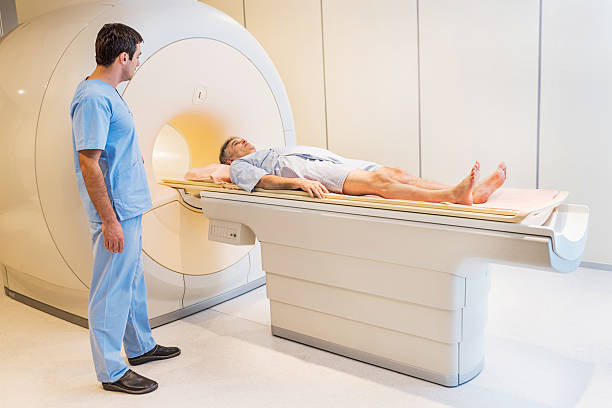 istock Mid adult radiologist and a patient. 502584793