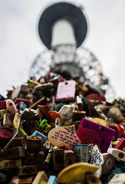 This a picture of one of the pyramids of lovelocks with the N.Seoul Tower in the background. This was taken after a hike up Namsan ( 남산) on a very cloudy day. There are literally thousands upon thousands of love locks around here piled on top of each other in the hope it will bring them long lasting love and friendship.