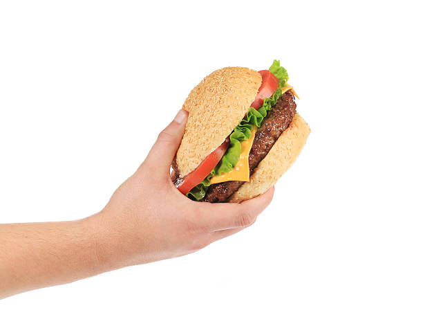 istock Male hand holding tasty hamburger. 502585191