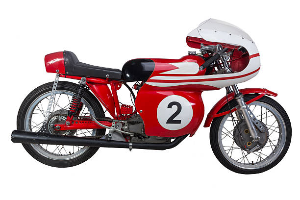 This is a closeup view of a classic blue motorcycle that beautifully showcases its vintage charm and design