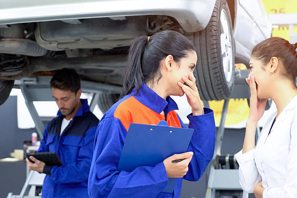 istock Two women gossiping in the garage 502586524
