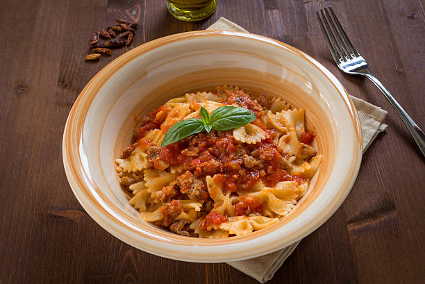 istock Farfalle with sausage and tomato sauce 502587727