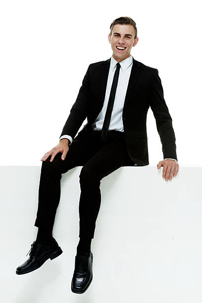istock Businessman sitting on wall 502588556