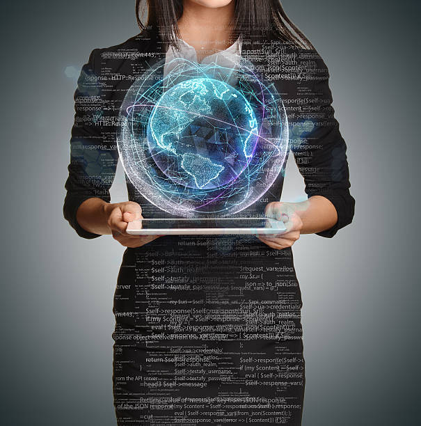 istock Young girl holding tablet in hands of virtual digital globe 502589848