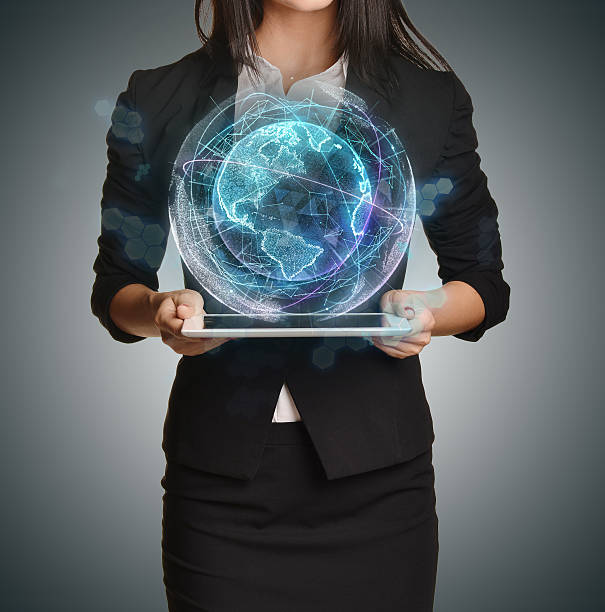 Young girl holding tablet in the hands of virtual digital Young girl holding tablet in the hands of virtual digital globe. white shirt black skirt stock pictures, royalty-free photos & images
