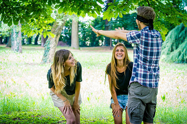 istock Group of friends having fun playing blind man's buff 502604181