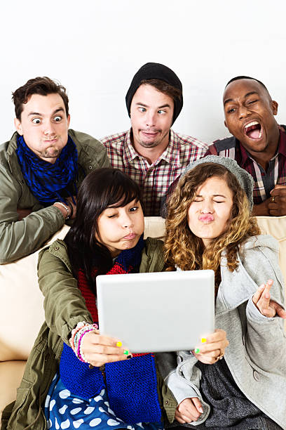 istock Five young people grimace horribly, taking selfie on digital tablet 502604237