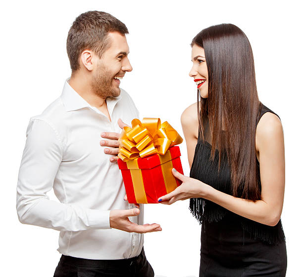 istock Young beautiful couple with present isolated on white 502604258