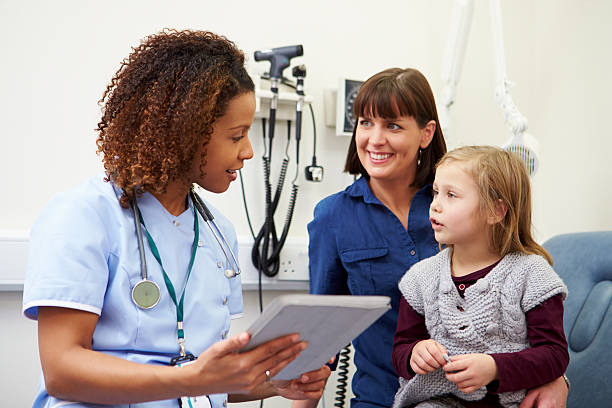 istock Appointment For Mother And Daughter With Nurse 502605209