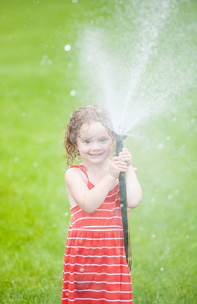 istock Girl Spraying Water 502605343