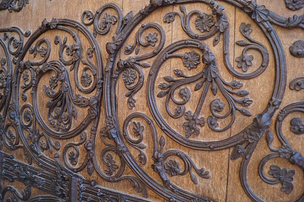 Close up photo of the detailed 13th-century ironwork that can be found on the wooden doors of Notre Dame in Paris. Taken in 2013