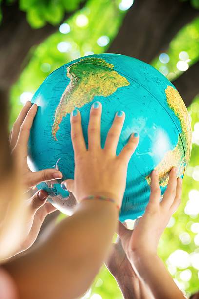 istock Group of People Holding a Globe 502606779