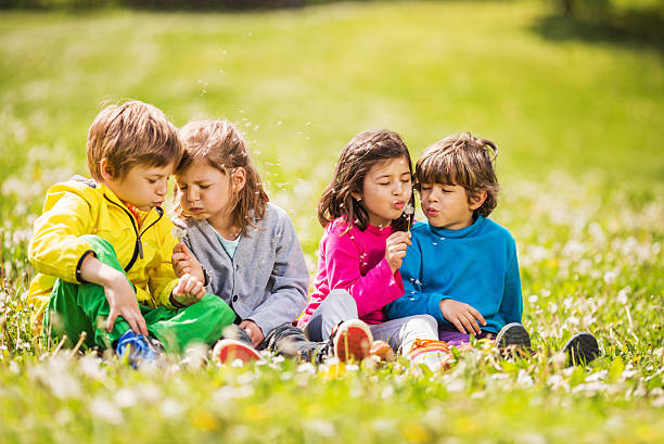 istock Children blowing dandelions. 502606797