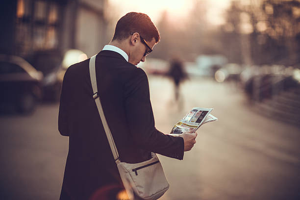 istock Businessman reading newspaper 502607082
