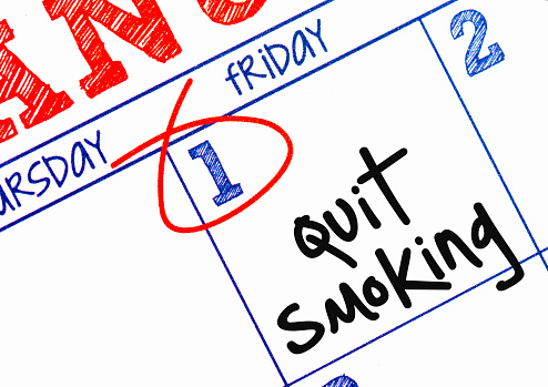 January calendar with note to quit smoking in New Year