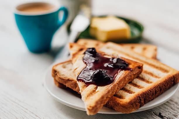 istock Breakfast with coffee, toasts, butter and jam 502610636