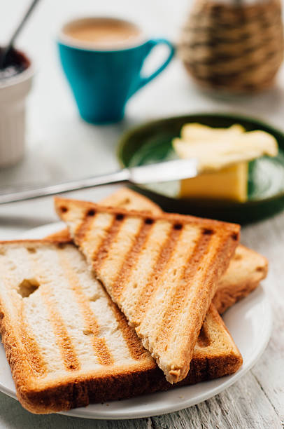 istock Breakfast with coffee, toasts, butter and jam 502610966