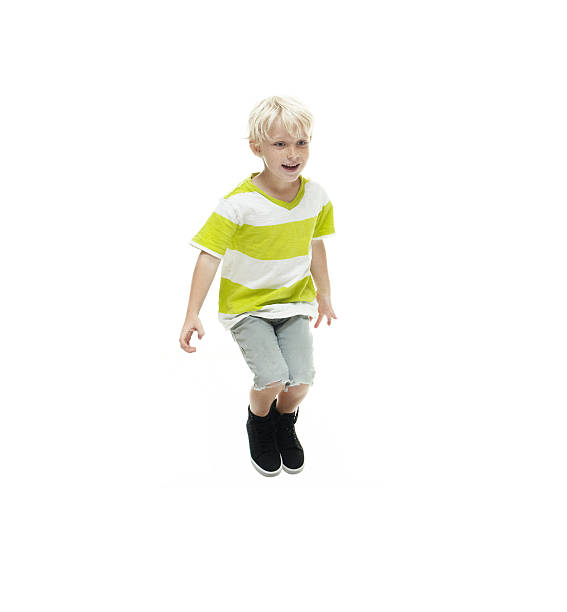 Smiling little boy jumping and looking awayhttp://www.twodozendesign.info/i/1.png