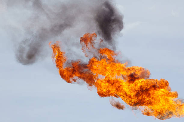 Fire torching against the sky stock photo