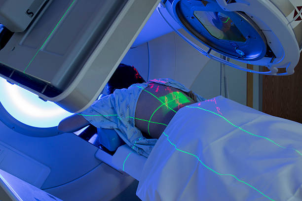 Woman receiving Radiation Therapy Treatments for Cancer stock photo