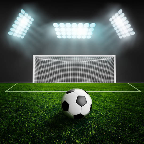 istock Soccer ball on green stadium arena 502618973