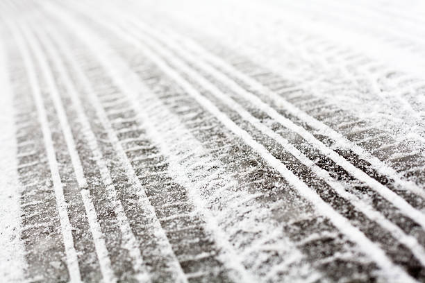 istock Wheel tracks on the road covered with snow 502621184