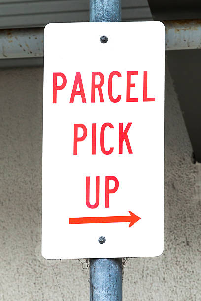istock Dirty Sign Stating PARCEL PICK UP with Right Arrow 502621527