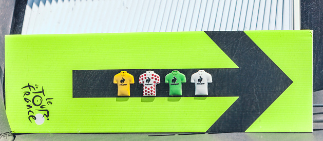  Col de Manse, France- July 16, 2013: Close-up image of an artisanal route indicator of Tour de France having sticked on it miniatures of the four distinctive jerseys of the competition, during the stage 16 of 100th edition of Le Tour de France 2013.