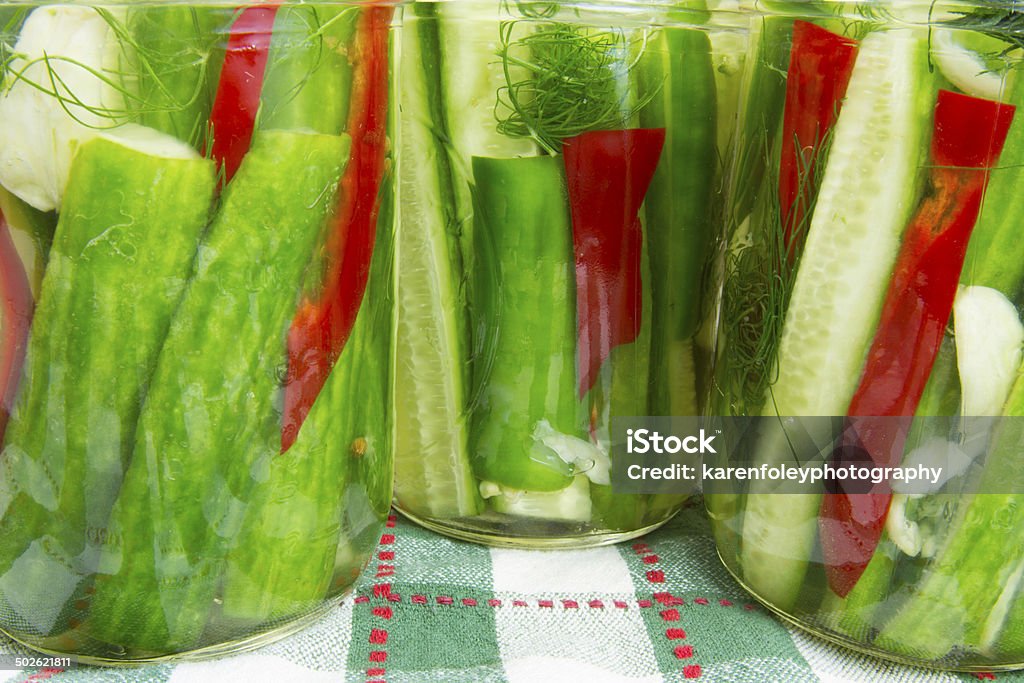 Jars of Dill Pickles Jars of quick pickles with garlic, dill and red peppers Canning Stock Photo