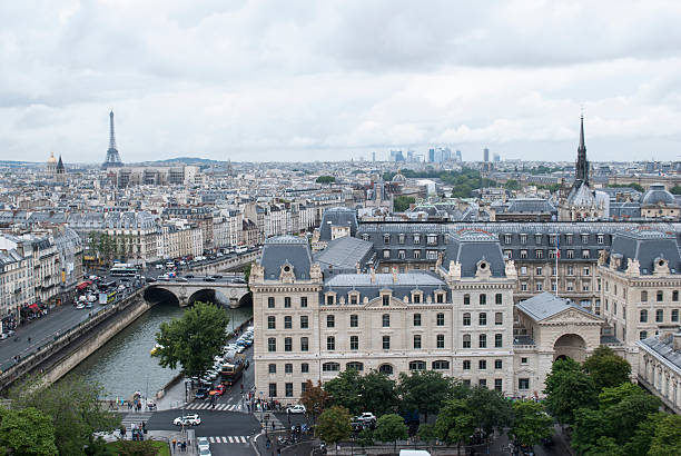 Eiffel Tower over Parisian roofs, and Seine river stock photo