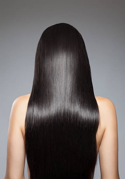 Long straight hair Back view of a woman with long straight hair long stock pictures, royalty-free photos & images