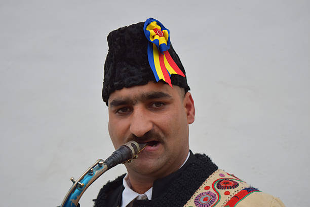 istock Gipsy singing traditional Romanian carols at saxophone. 502630260