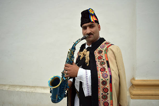 istock Gipsy singing traditional Romanian carols at saxophone. 502630272