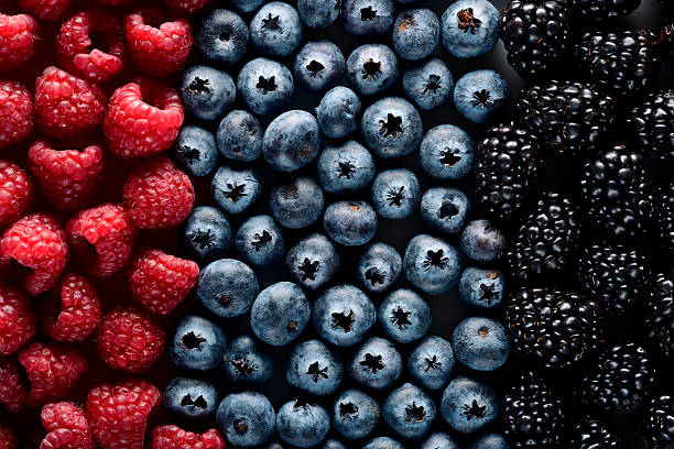 Forest berries Сolorful flag with fruits of the forest raspberry stock pictures, royalty-free photos & images
