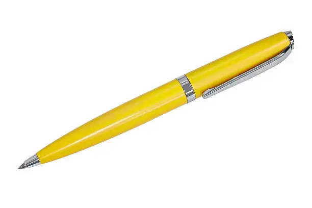 Yellow ballpoint pen on white background.