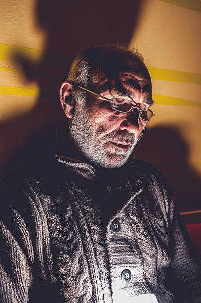 istock Senior Man Using Mobile Phone at Night, Face Illuminated 502636282