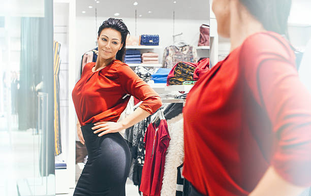 istock Woman trying on some clothes at a retail store. 502636372