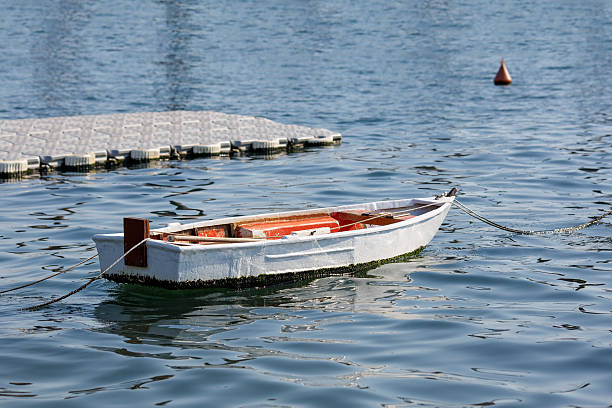Small wooden boat in a marina in Kotor Bay, Montenegro stock photo