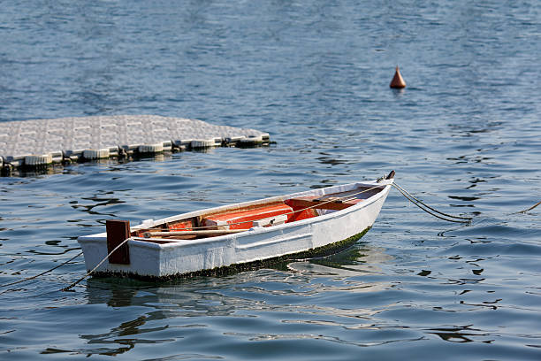 Small wooden boat in a marina in Kotor Bay, Montenegro stock photo