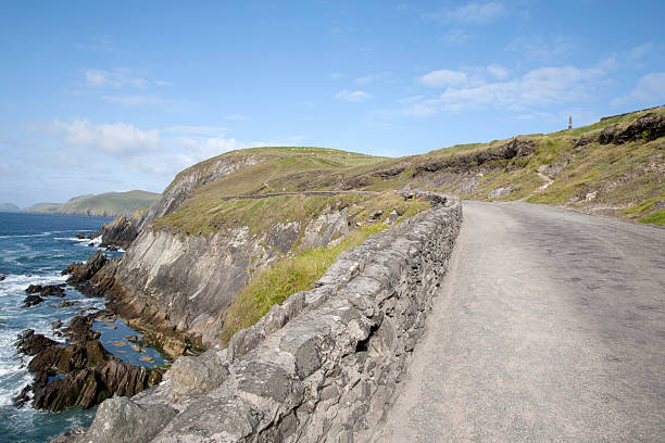 istock Road down to Coumeenoole Beach, Slea Head in Dingle Peninsula 502638326