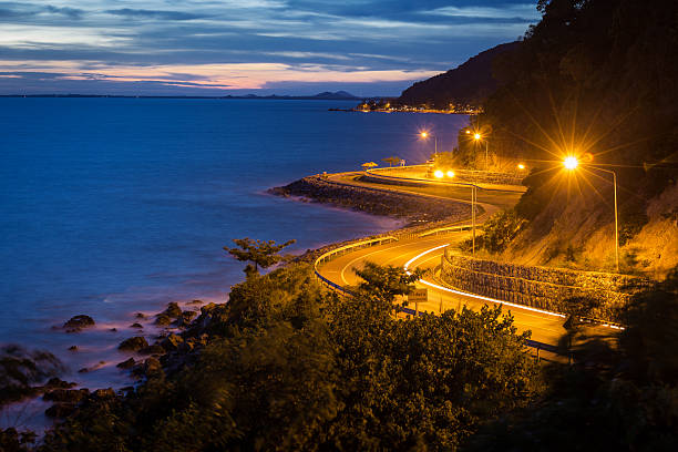 istock twilight sky curvy road streak light blue sea 502639862