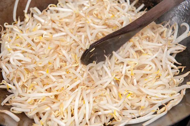 Beansprouts in a hot wok being fried