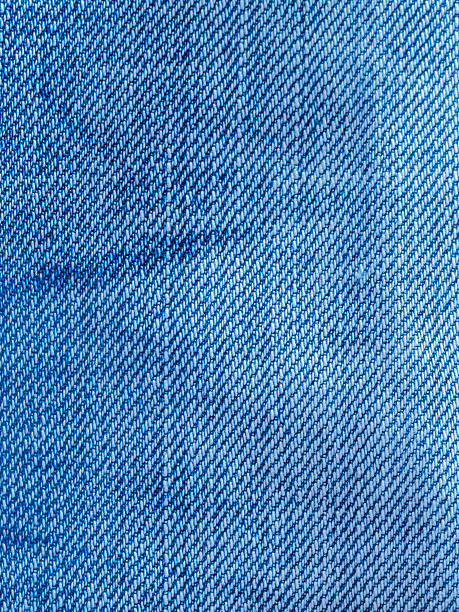 istock Texture of blue jeans fabric used and old 502641421